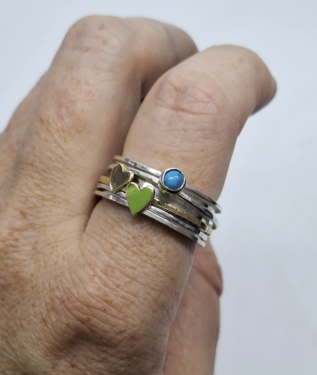 spinner ring with turquoise on hand